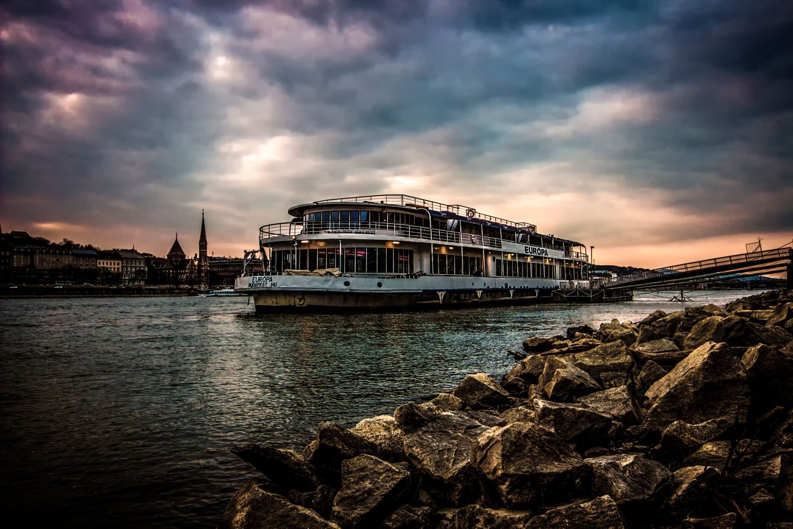River cruise ship on the Danube in Budapest under a dramatic sky, one of the best river cruises in the world